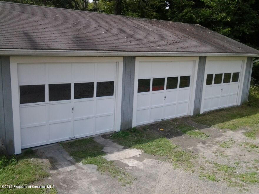 88 Lake Side Road Hop Bottom, PA 18824 - Photo 40 of 40 a front view of a house with a yard