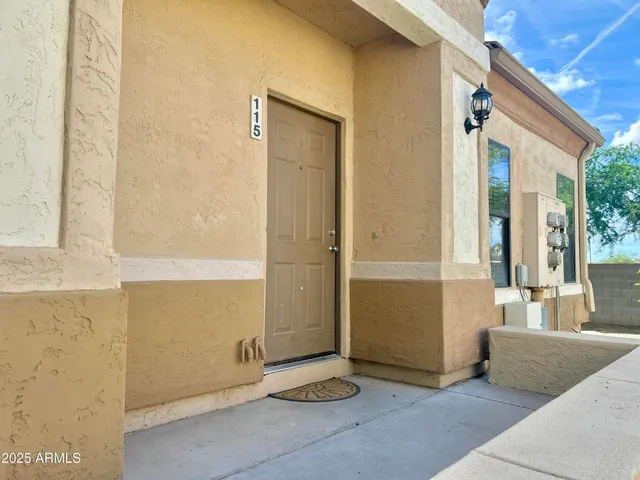 a view of an entryway with wooden floor and door