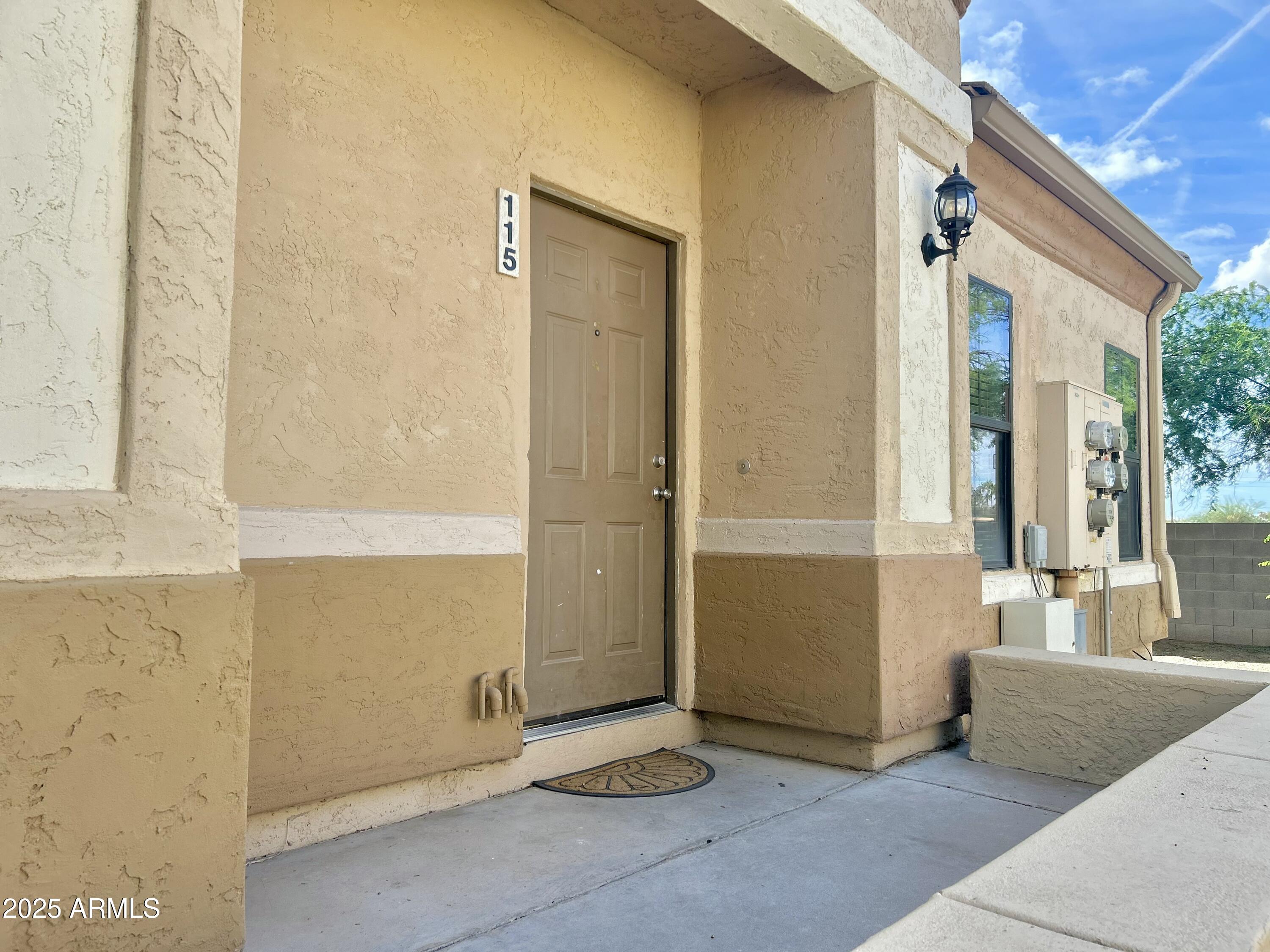 a view of an entryway with wooden floor and door