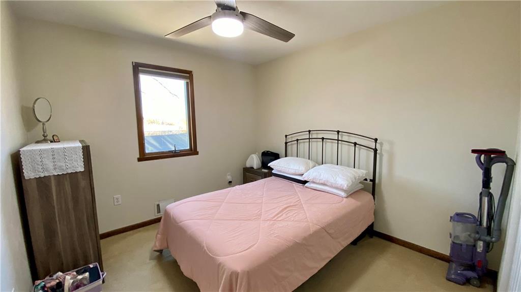 200 Porter Street Springdale, PA 15144 - Photo 12 of 35 a bedroom with a bed closet and a mirror