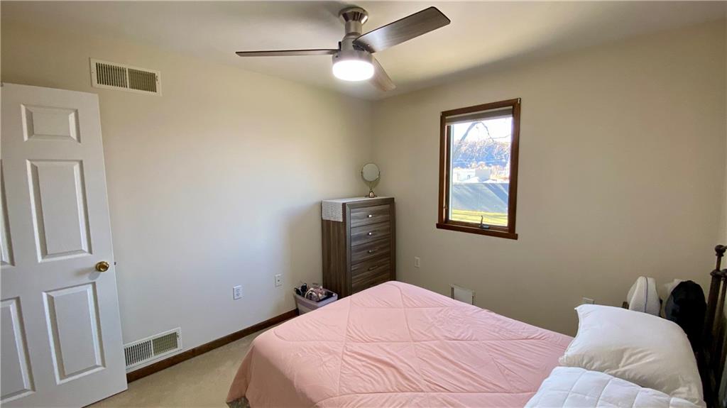 200 Porter Street Springdale, PA 15144 - Photo 13 of 35 a bedroom with a bed and a window