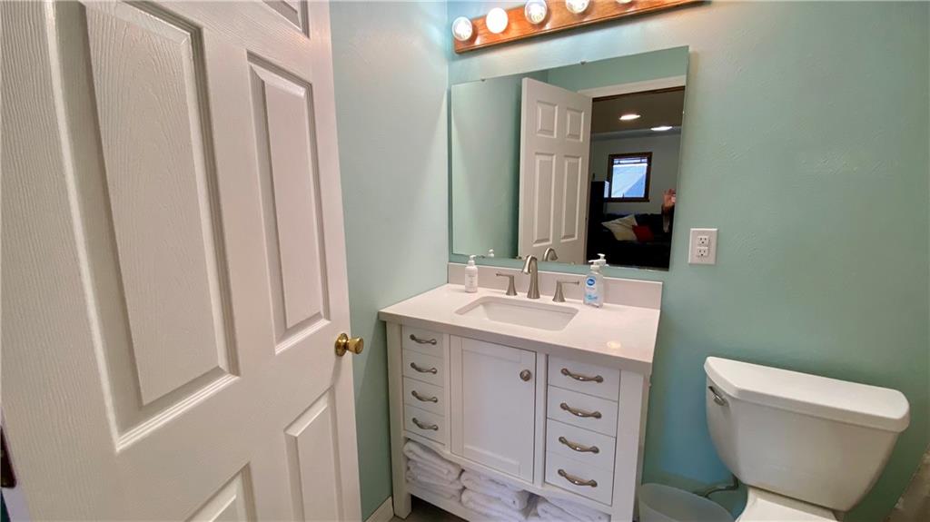 200 Porter Street Springdale, PA 15144 - Photo 18 of 35 a bathroom with a sink a toilet and a mirror
