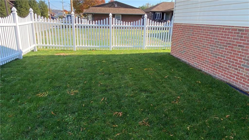 200 Porter Street Springdale, PA 15144 - Photo 33 of 35 a view of a house with a small yard and a garden