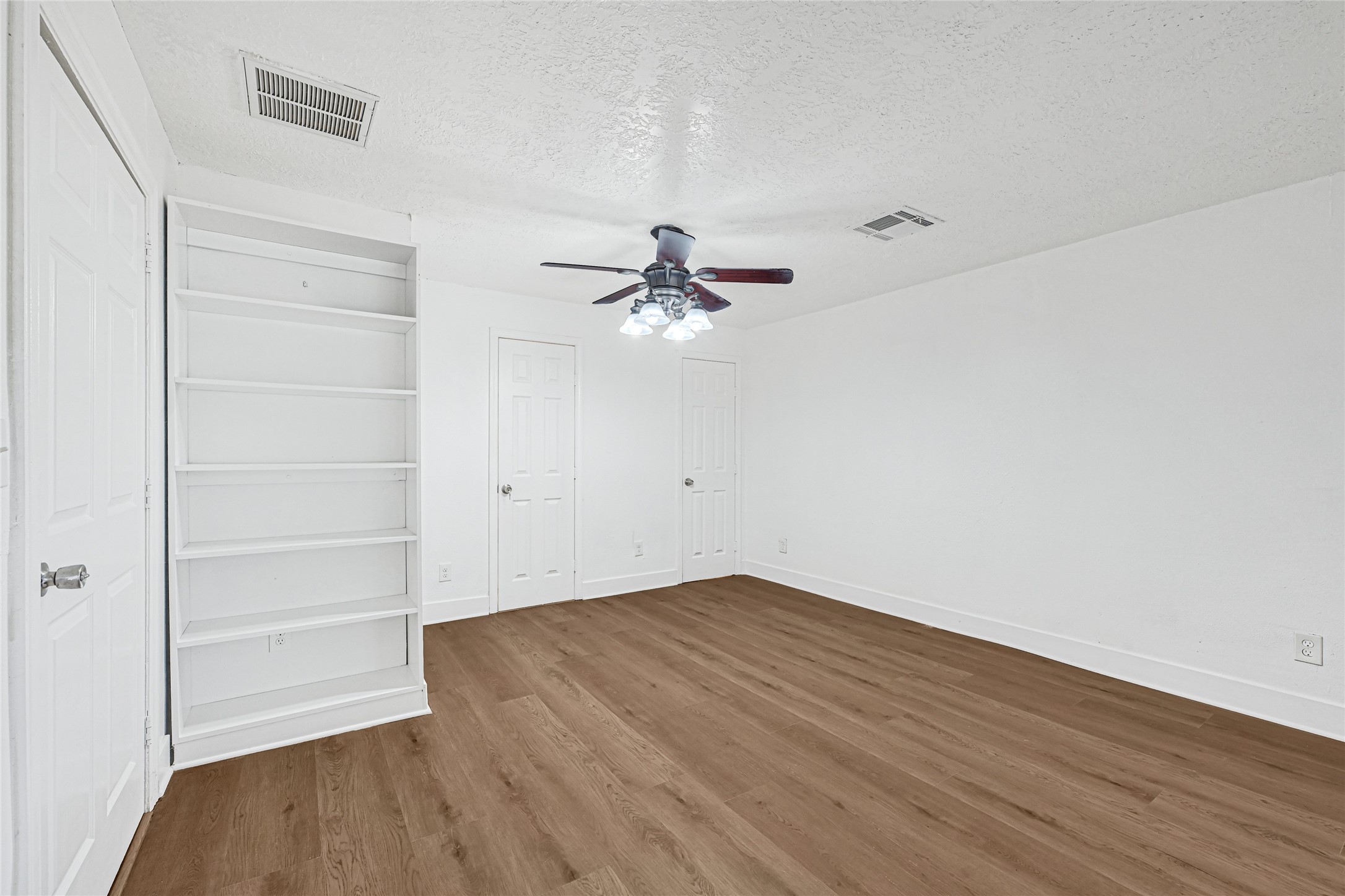 4215 East Lane Houston, TX 77026 - Photo 12 of 25 wooden floor in an empty room