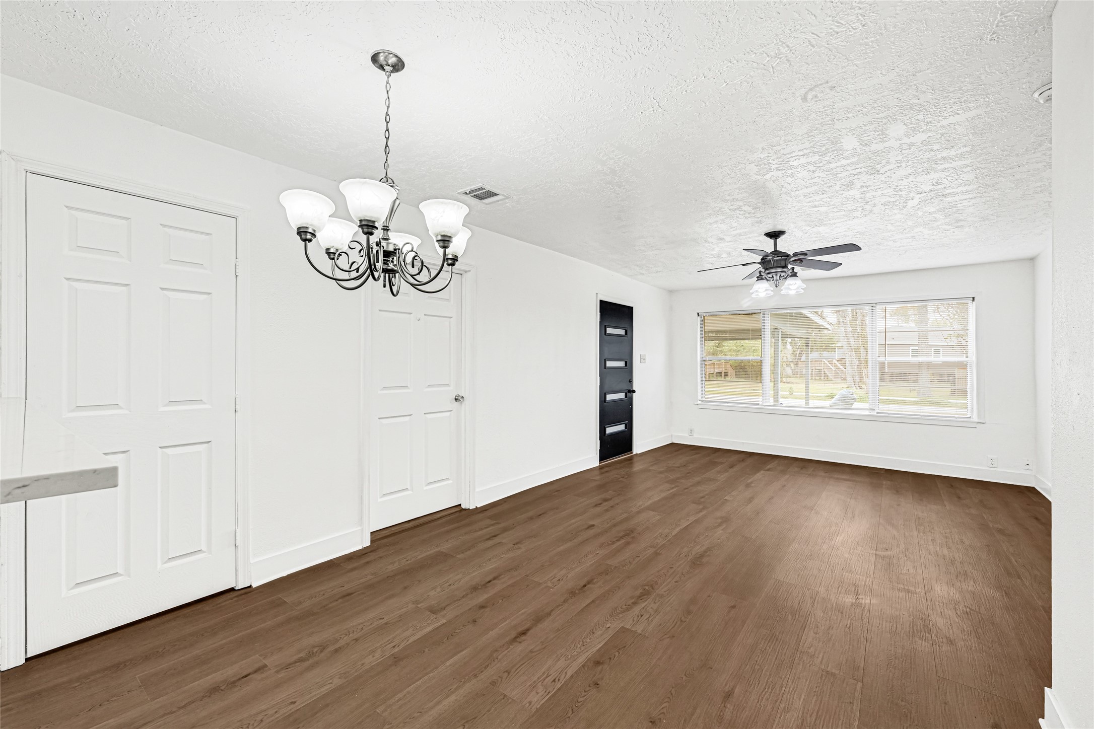 4215 East Lane Houston, TX 77026 - Photo 5 of 25 a view of an empty room with window and wooden floor