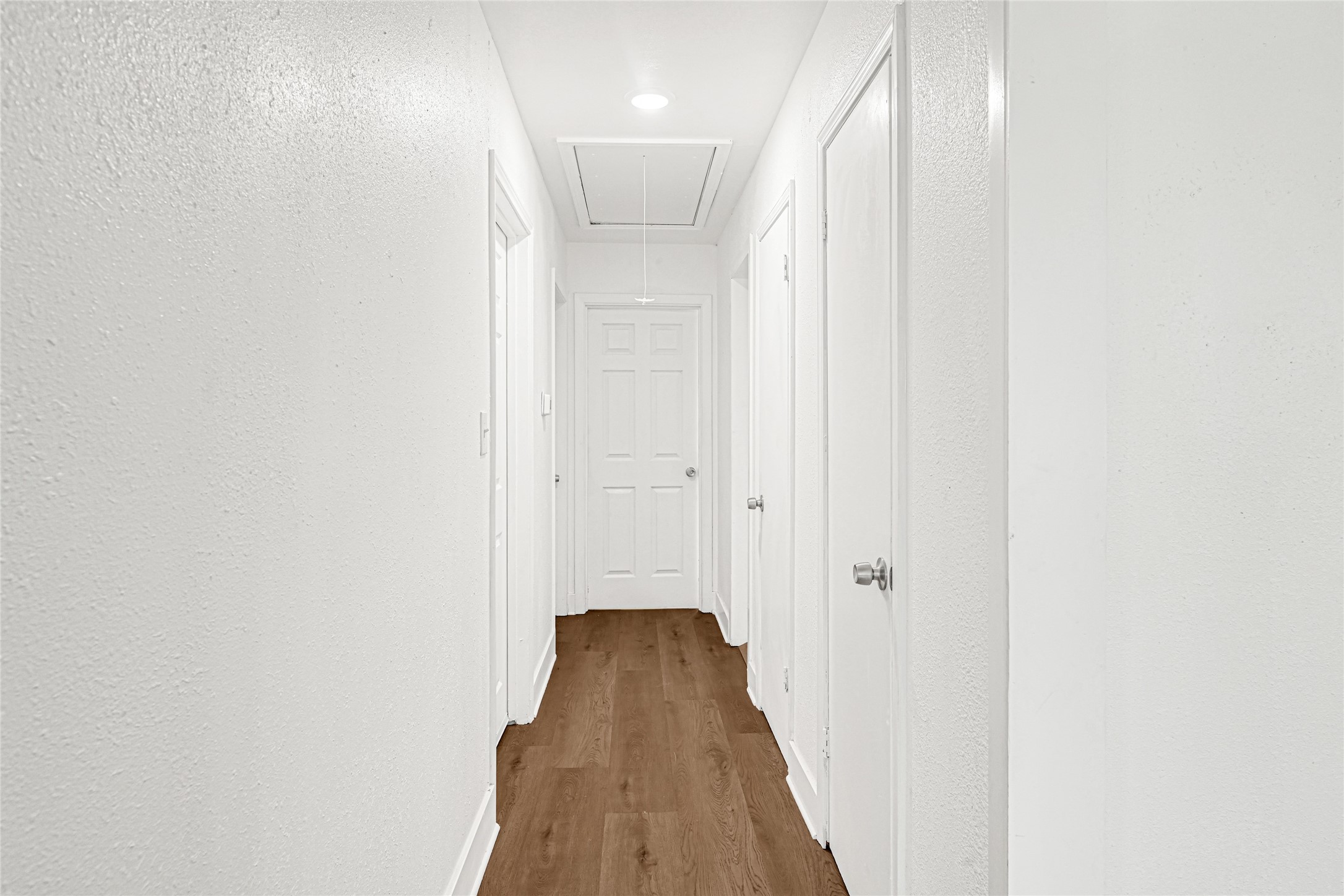 4215 East Lane Houston, TX 77026 - Photo 6 of 25 a view of a hallway with wooden floor