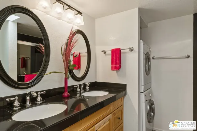 a bathroom with a sink a mirror and a mirror