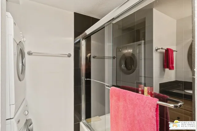 a kitchen with a refrigerator and a stove top oven