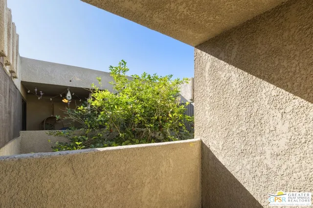 a view of a livingroom with furniture and staircase