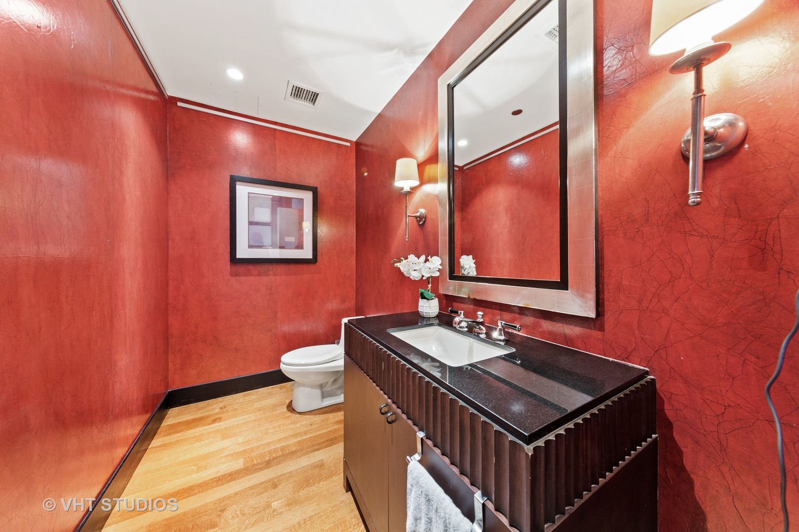 800 North Michigan Avenue, Unit 2003 Chicago, IL 60611 - Photo 12 of 23 a bathroom with a sink a toilet and mirror
