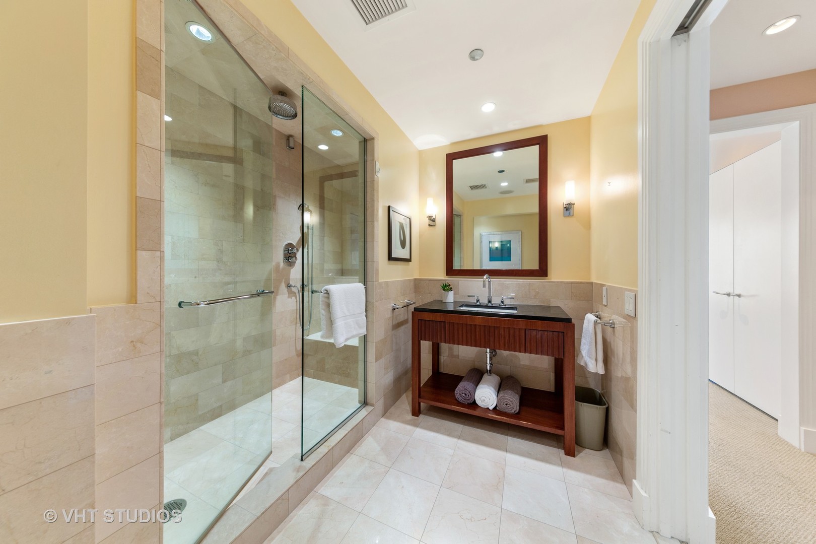 800 North Michigan Avenue, Unit 2003 Chicago, IL 60611 - Photo 15 of 23 a bathroom with a mirror and a shower