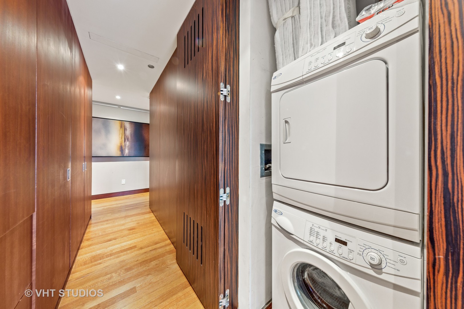 800 North Michigan Avenue, Unit 2003 Chicago, IL 60611 - Photo 23 of 23 a view of a hallway with washer and dryer