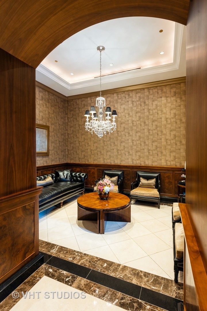 800 North Michigan Avenue, Unit 2003 Chicago, IL 60611 - Photo 3 of 23 a living room with furniture and a rug