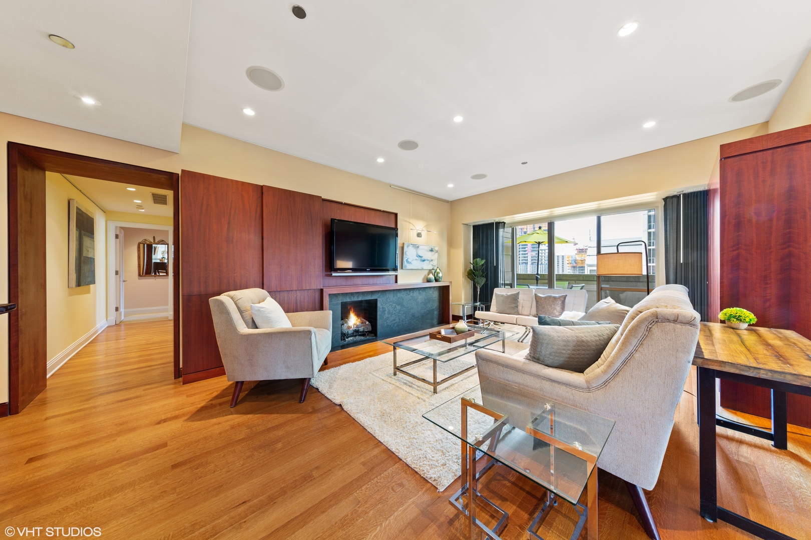 800 North Michigan Avenue, Unit 2003 Chicago, IL 60611 - Photo 6 of 23 a living room with fireplace furniture and a flat screen tv