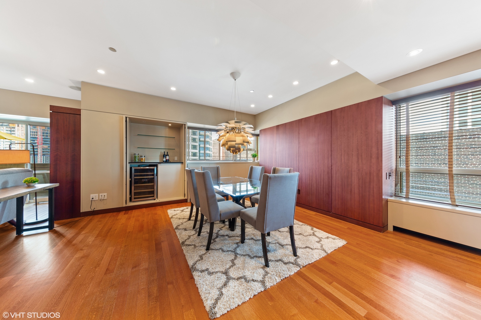 800 North Michigan Avenue, Unit 2003 Chicago, IL 60611 - Photo 8 of 23 a view of a dining room with furniture and wooden floor