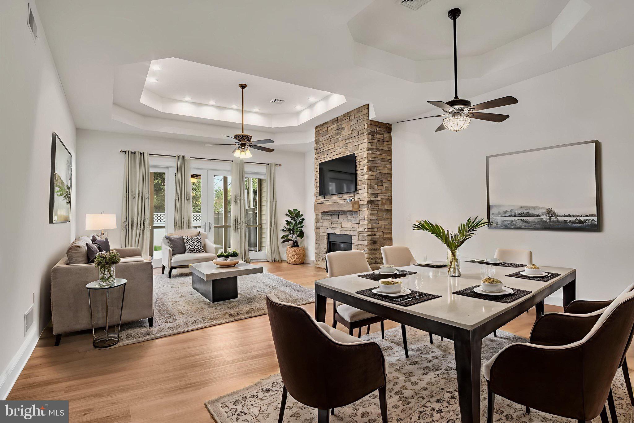 2224 Eastern Boulevard, Unit B York, PA 17402 - Photo 13 of 60 a living room with furniture a table and a chandelier