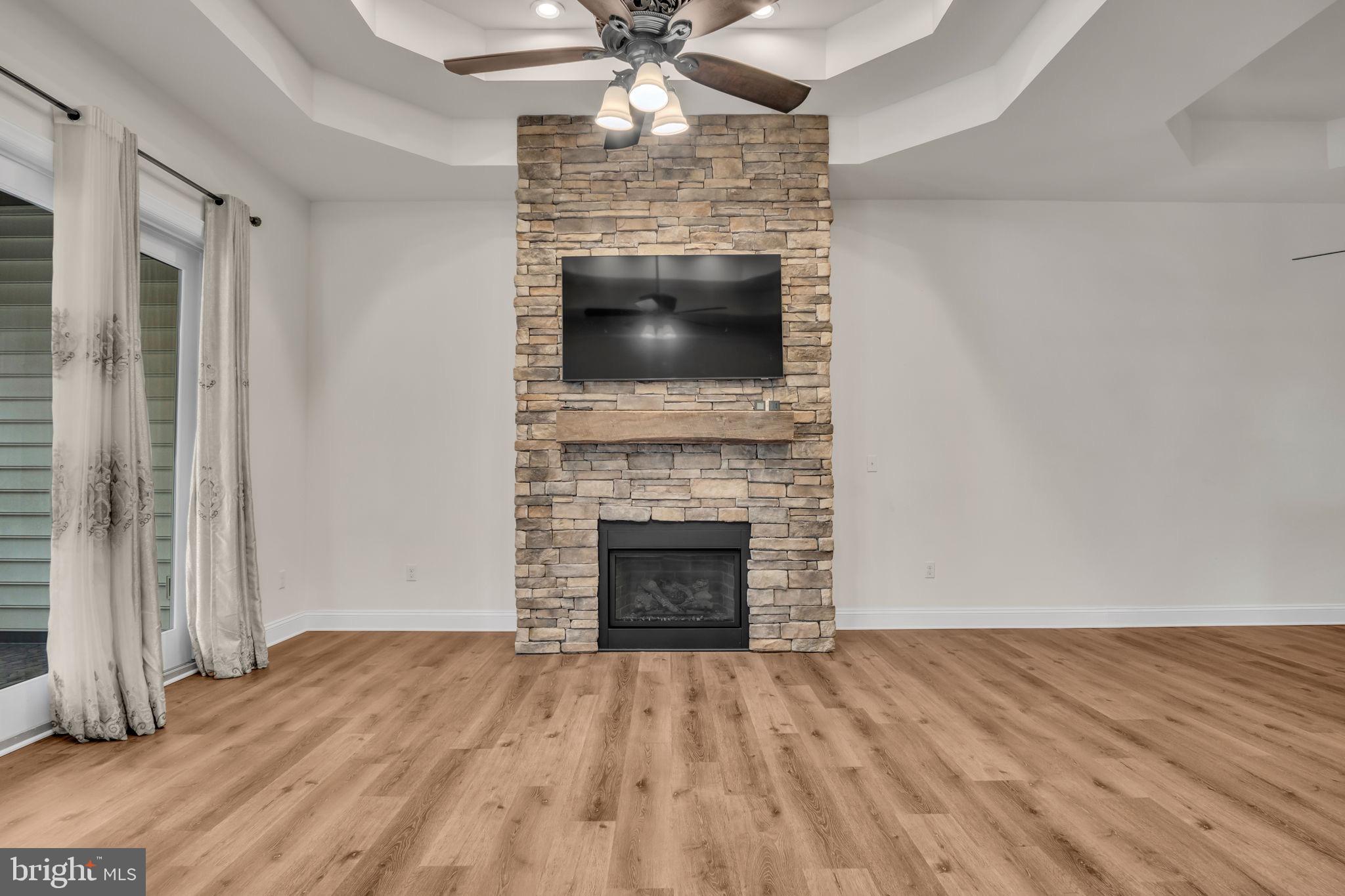 2224 Eastern Boulevard, Unit B York, PA 17402 - Photo 16 of 60 wooden floor fireplace and natural light