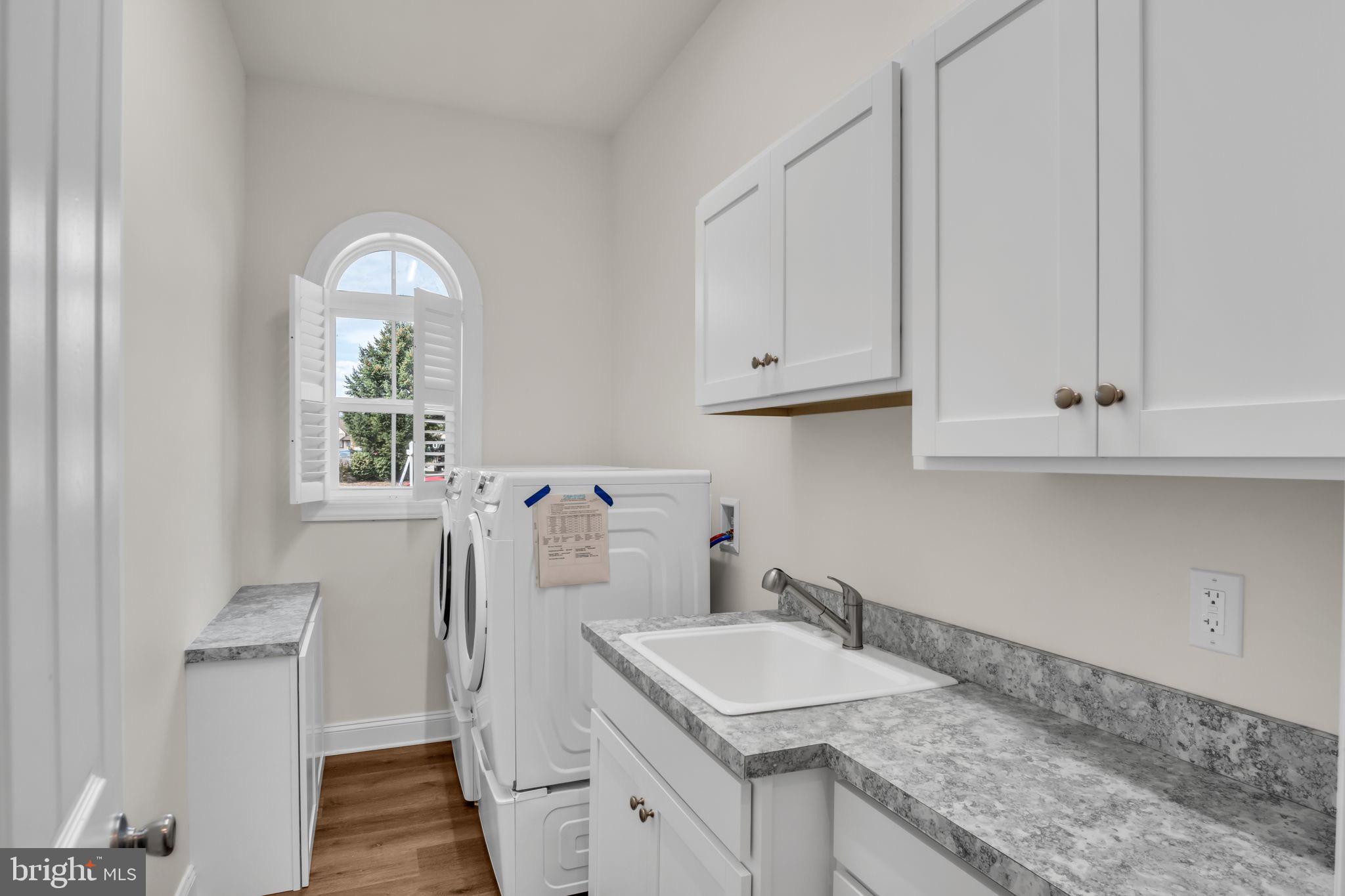 2224 Eastern Boulevard, Unit B York, PA 17402 - Photo 27 of 60 a kitchen with stainless steel appliances granite countertop a sink and dishwasher with white cabinets