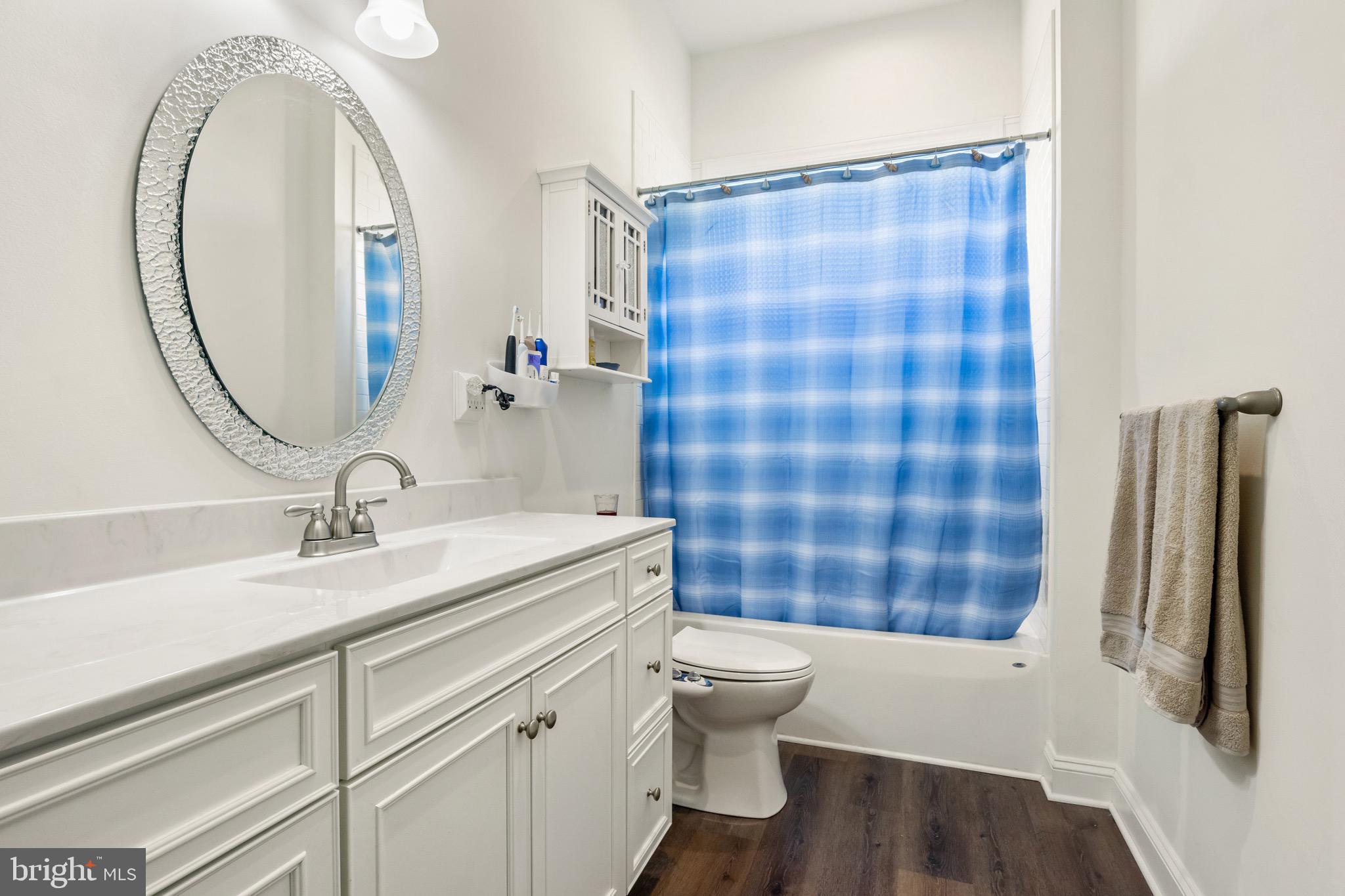 2224 Eastern Boulevard, Unit B York, PA 17402 - Photo 37 of 60 a bathroom with a sink a toilet a mirror and shower