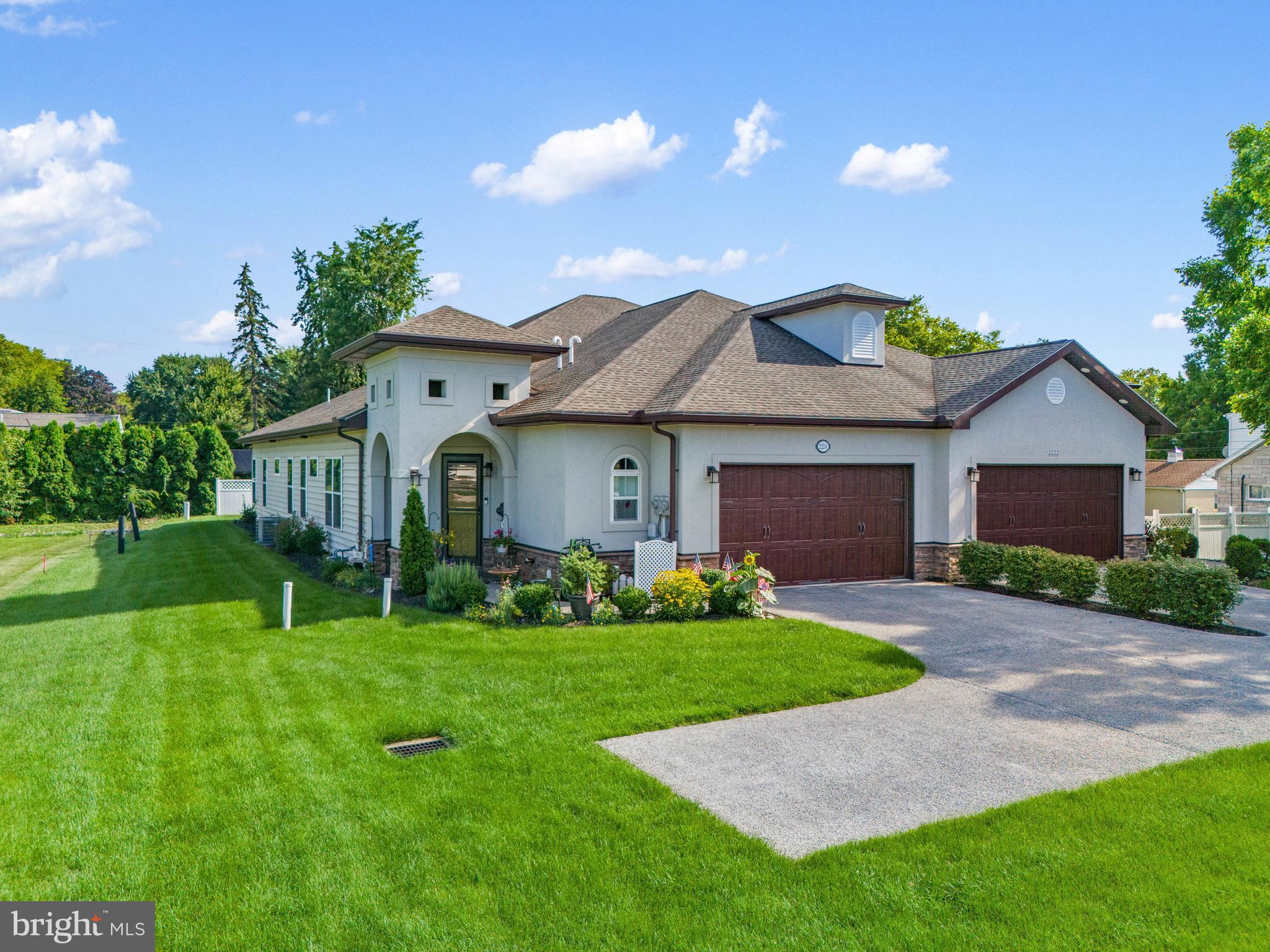 2224 Eastern Boulevard, Unit B York, PA 17402 - Photo 6 of 60 a front view of a house with a garden