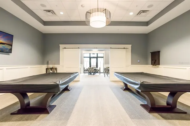 a view of a roof deck with couches and potted plants
