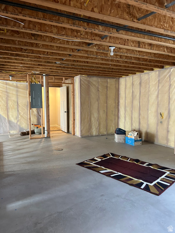 175 North 100th West Centerfield, UT 84622 - Photo 30 of 32 Unfinished basement space with exposed wooden ceiling joists and concrete flooring