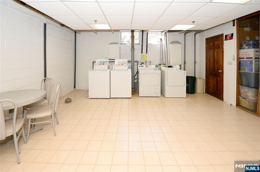21-31 Ridge Road, Unit D15 Ridgewood, NJ 07450 - Photo 11 of 16 a view of kitchen with furniture and refrigerator