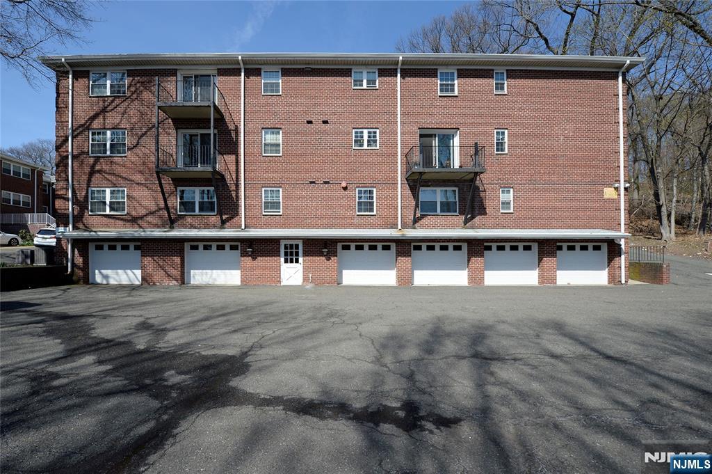 21-31 Ridge Road, Unit D15 Ridgewood, NJ 07450 - Photo 15 of 16 front view of a building with a street