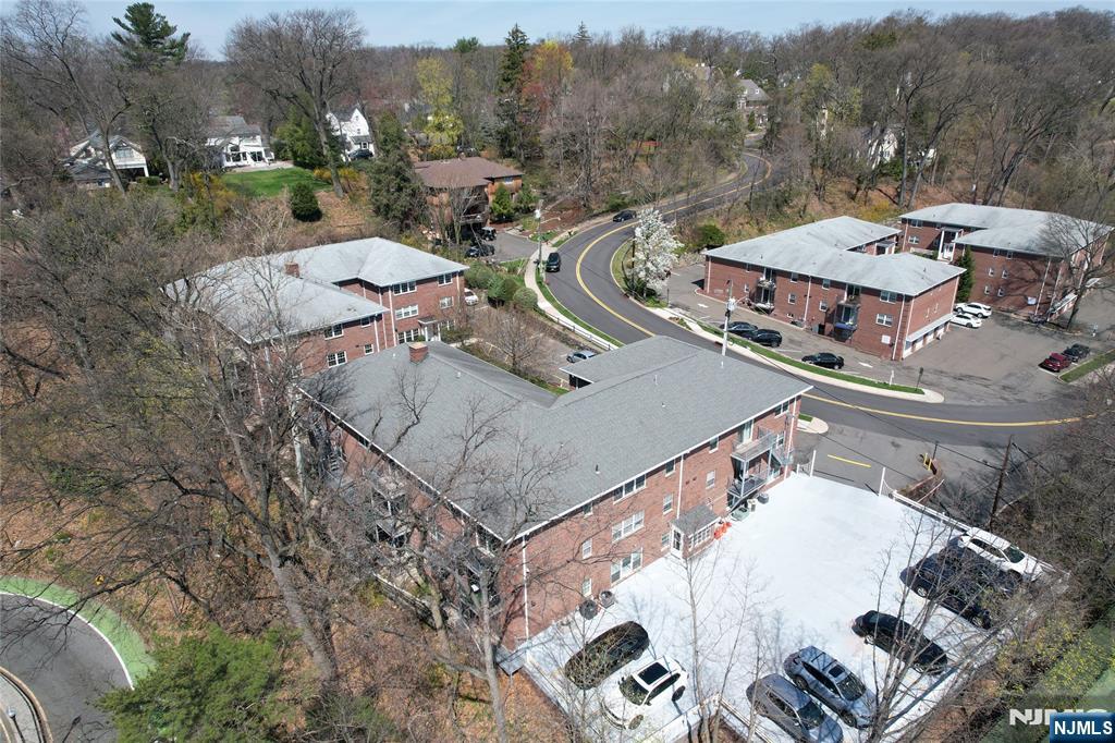 21-31 Ridge Road, Unit D15 Ridgewood, NJ 07450 - Photo 16 of 16 an aerial view of a house having patio