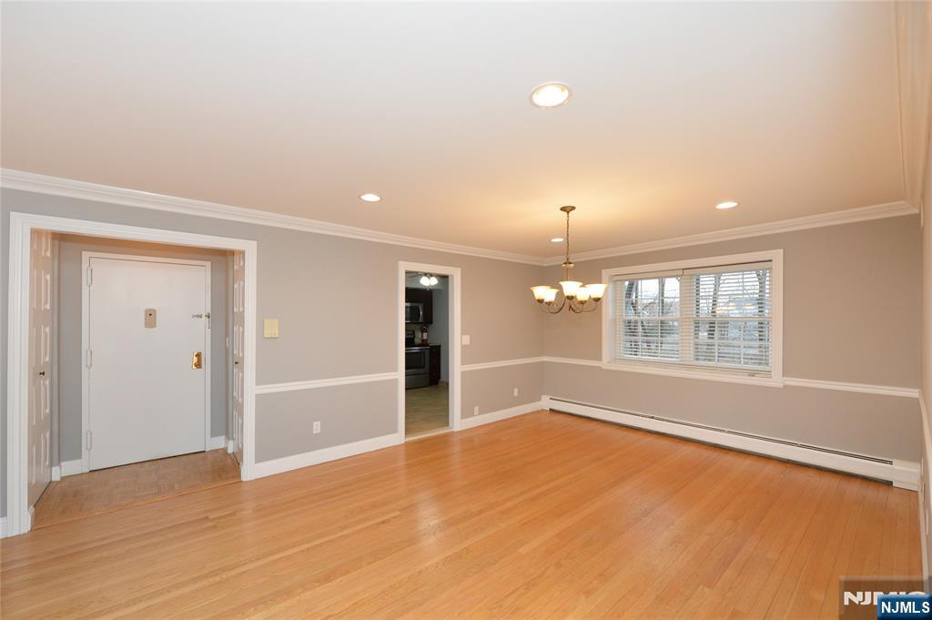 21-31 Ridge Road, Unit D15 Ridgewood, NJ 07450 - Photo 2 of 16 wooden floor in an empty room with a window