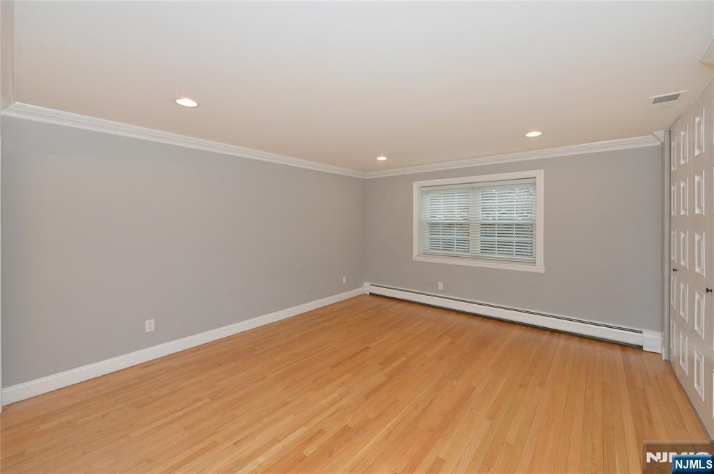 21-31 Ridge Road, Unit D15 Ridgewood, NJ 07450 - Photo 8 of 16 an empty room with a empty space and a window