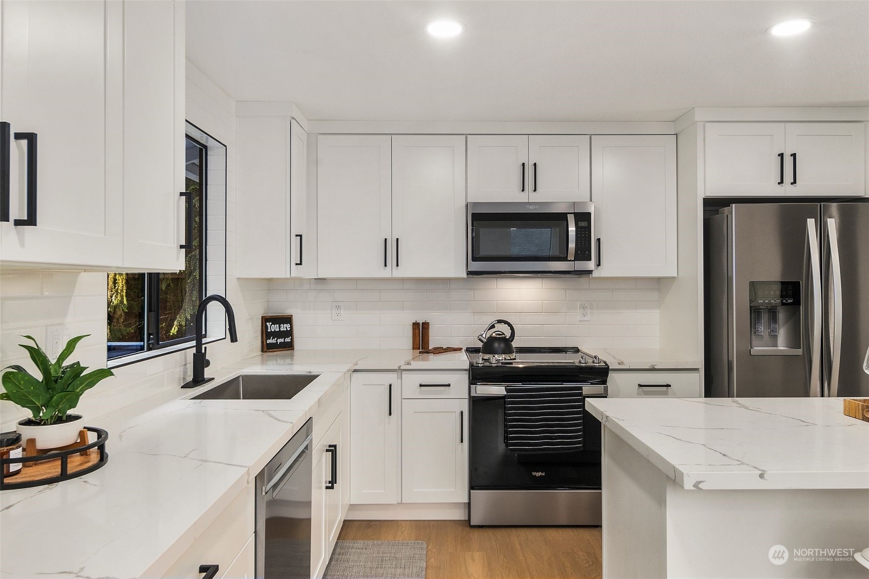 3006 164th Place Southeast Bothell, WA 98012 - Photo 11 of 39 a kitchen with a sink a stove and refrigerator