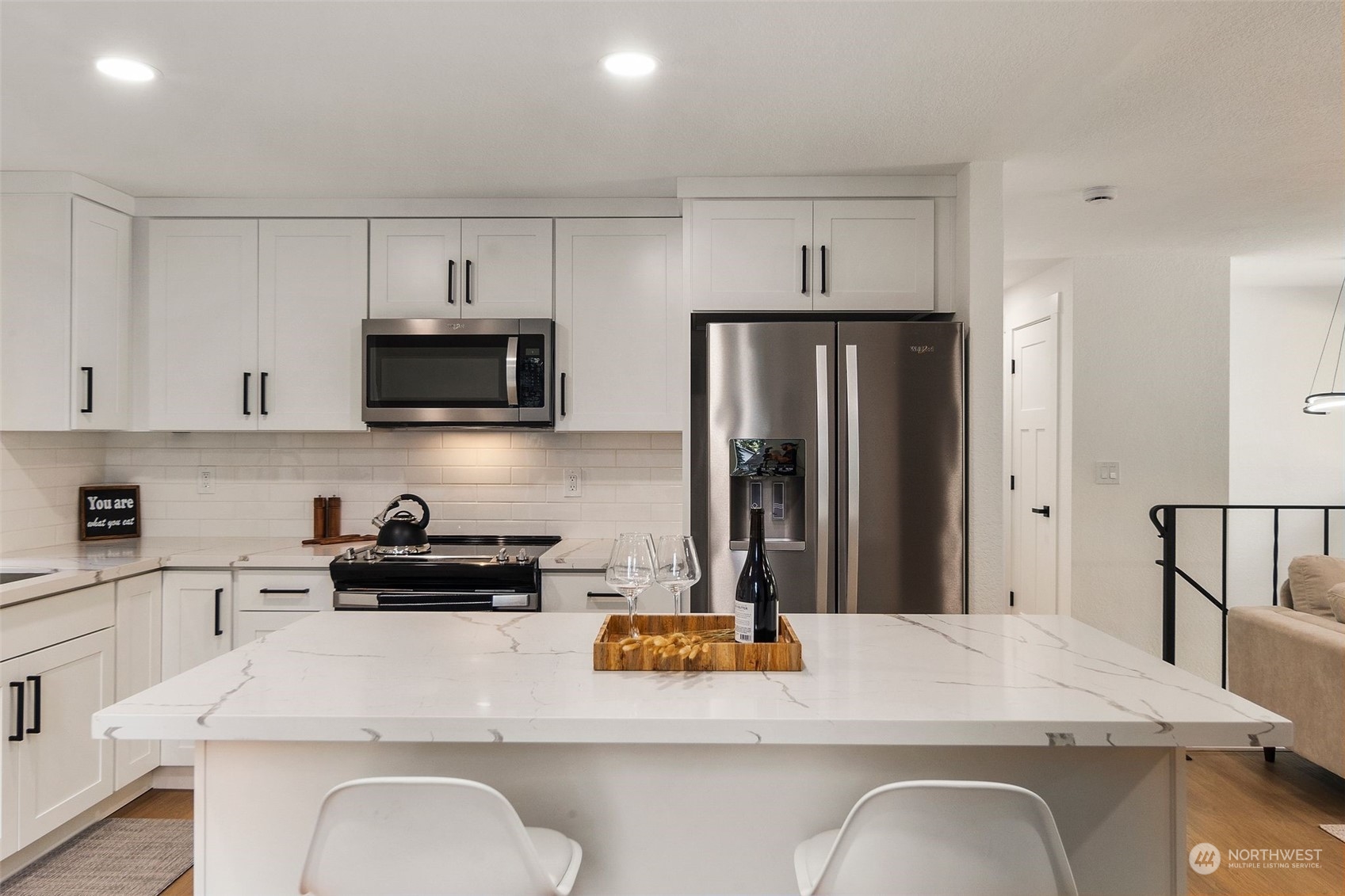3006 164th Place Southeast Bothell, WA 98012 - Photo 13 of 39 a kitchen with stainless steel appliances granite countertop a refrigerator a stove top oven a sink and dishwasher