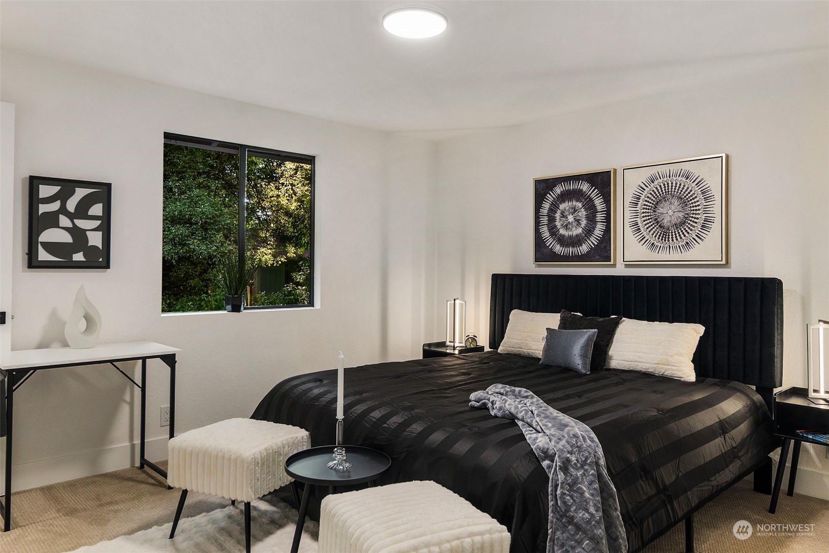 3006 164th Place Southeast Bothell, WA 98012 - Photo 17 of 39 a bedroom with a bed and a painting on the wall