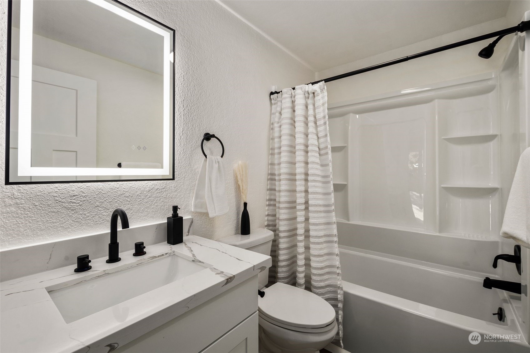 3006 164th Place Southeast Bothell, WA 98012 - Photo 18 of 39 a bathroom with a sink mirror toilet and bathtub