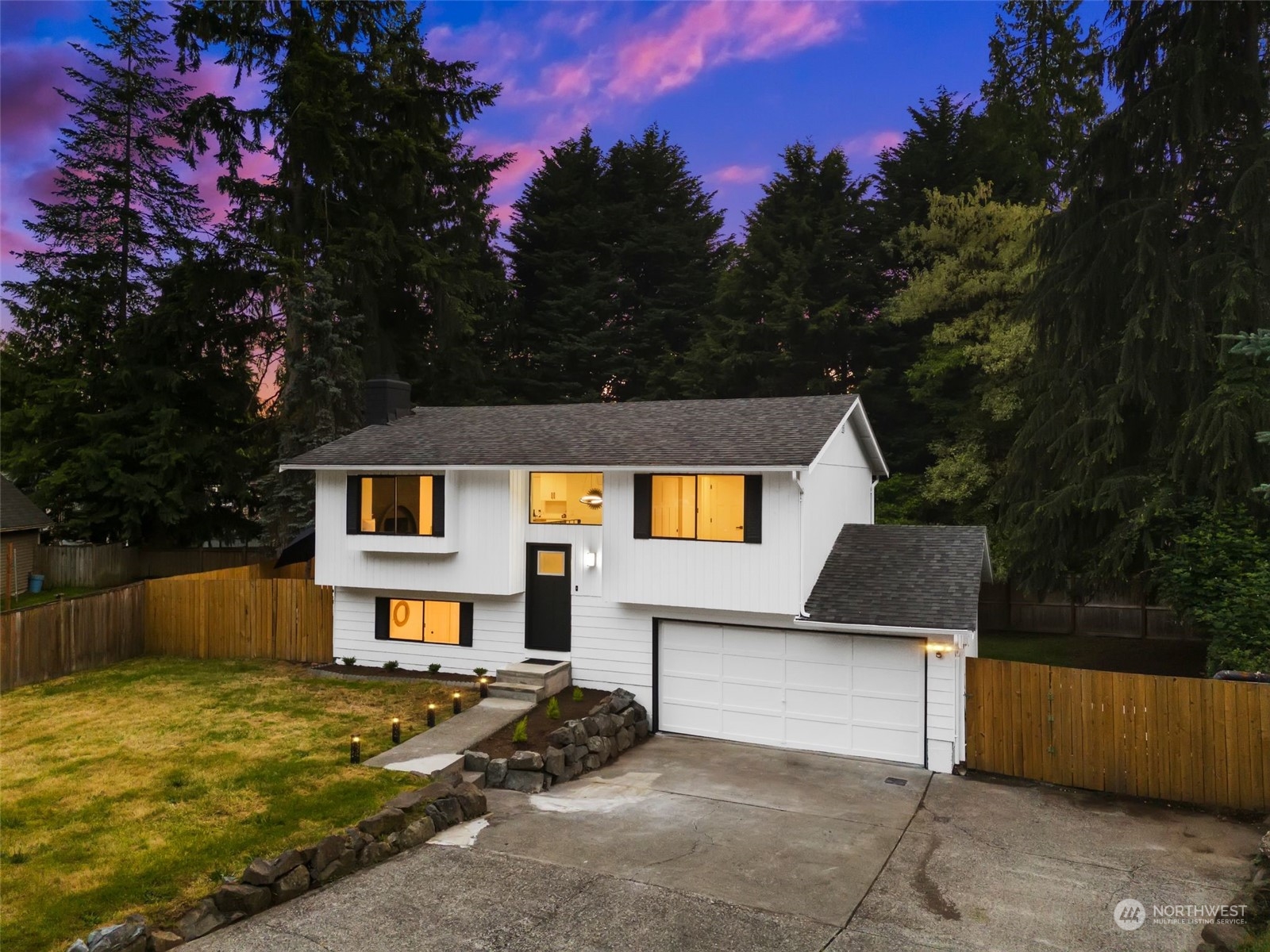3006 164th Place Southeast Bothell, WA 98012 - Photo 2 of 39 a front view of a house with a yard