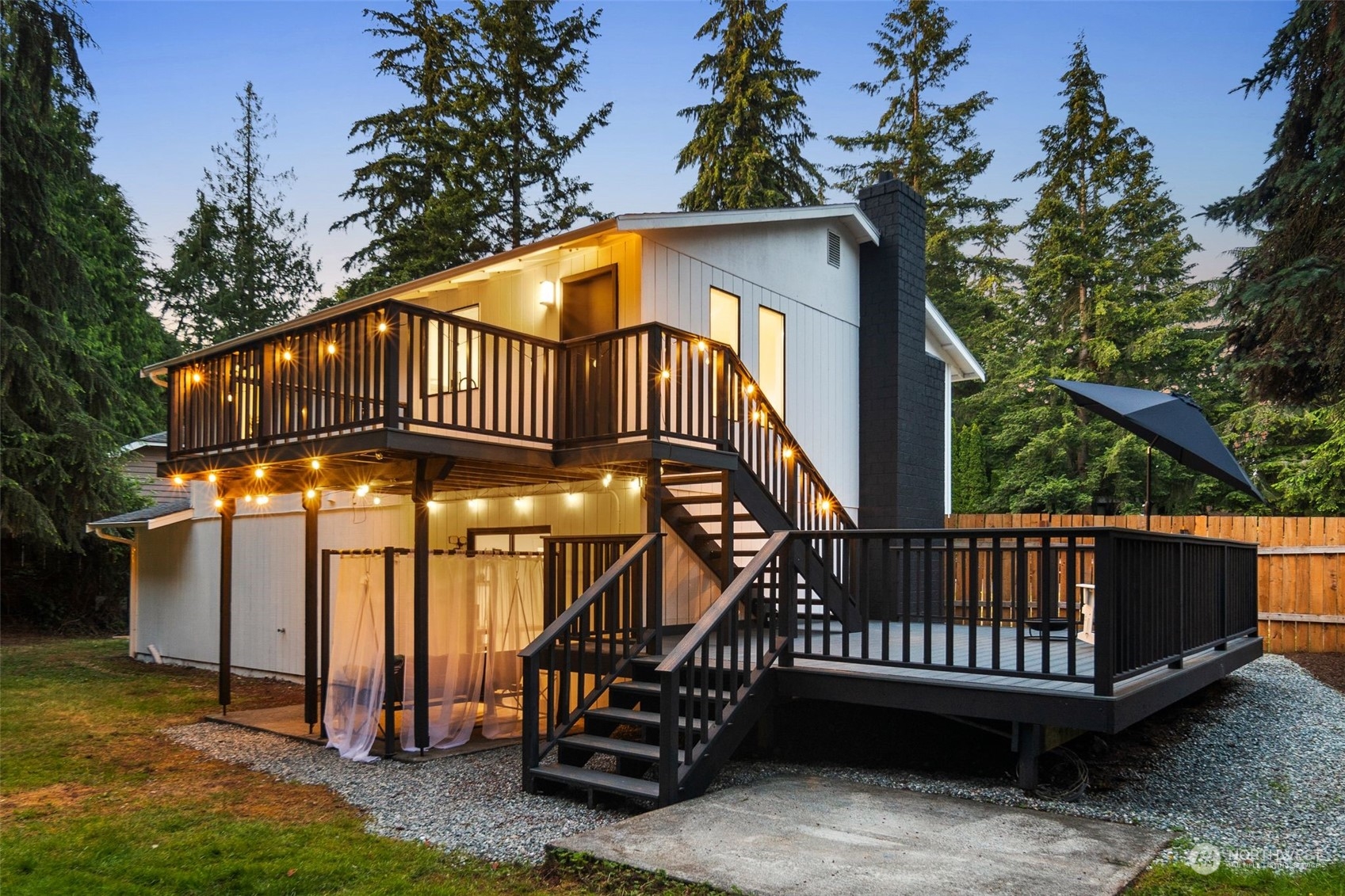 3006 164th Place Southeast Bothell, WA 98012 - Photo 31 of 39 a view of a house with a yard deck and a garden