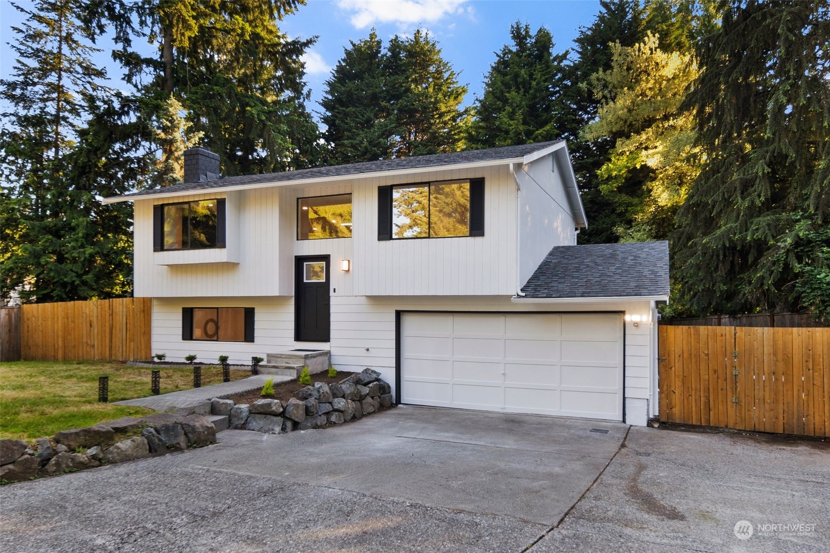 3006 164th Place Southeast Bothell, WA 98012 - Photo 38 of 39 a front view of a house with garden and parking