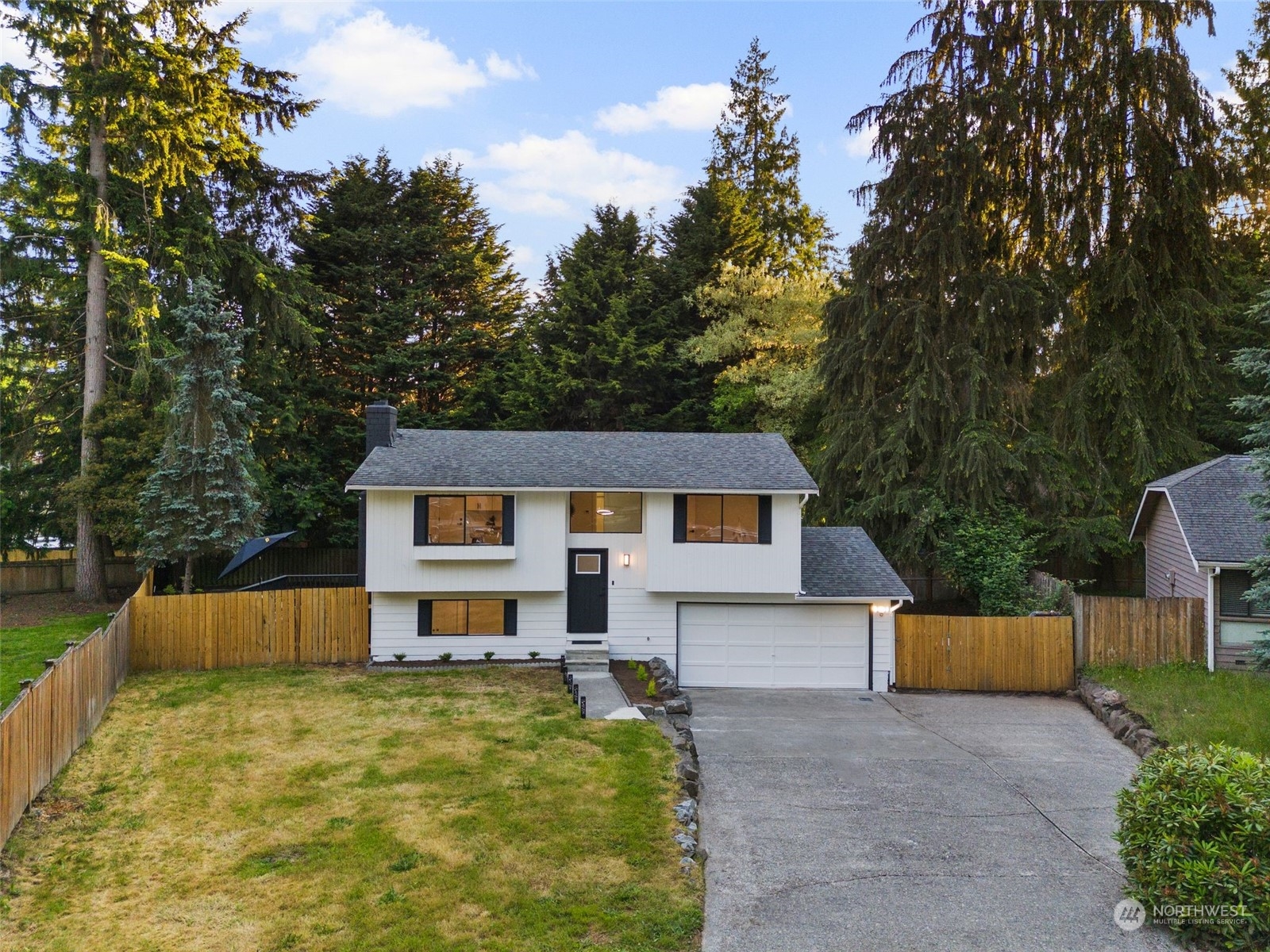 3006 164th Place Southeast Bothell, WA 98012 - Photo 39 of 39 a front view of a house with a yard and trees