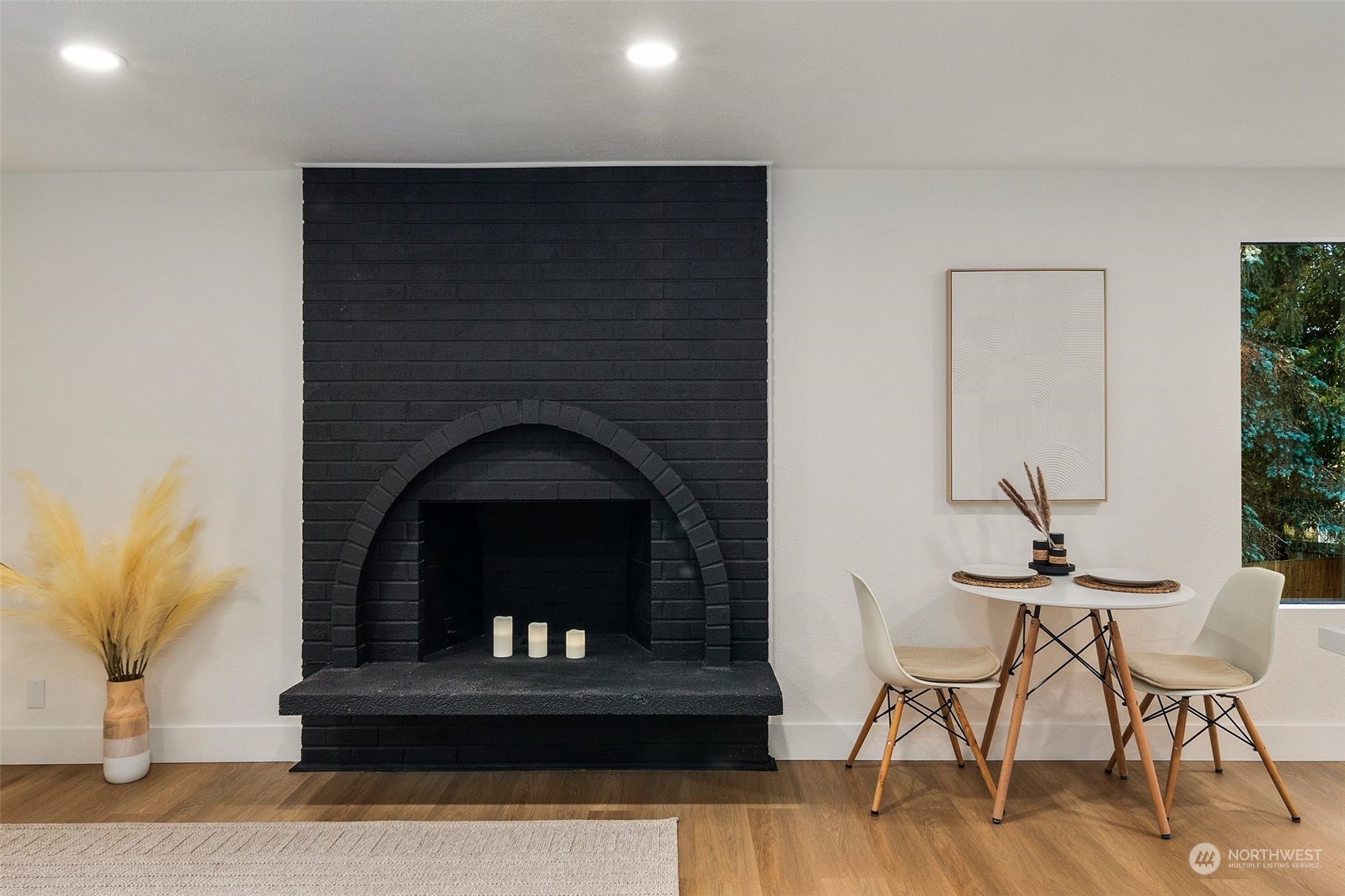 3006 164th Place Southeast Bothell, WA 98012 - Photo 6 of 39 a living room with a fireplace and a potted plant