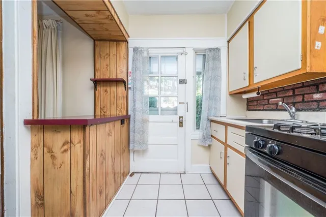 a kitchen with a stove and a refrigerator