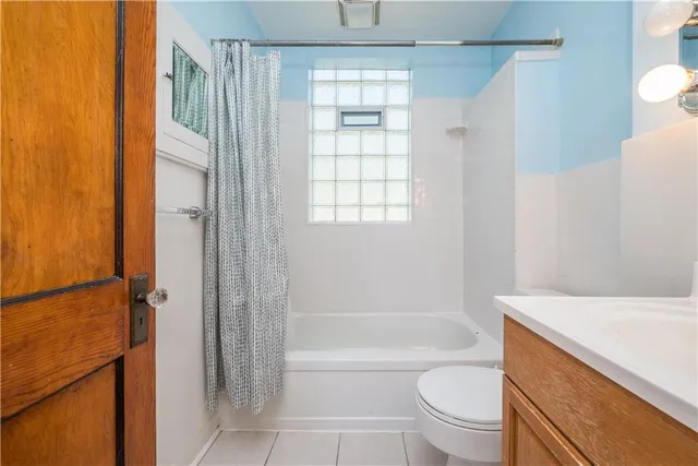 a bathroom with a bathtub toilet and sink