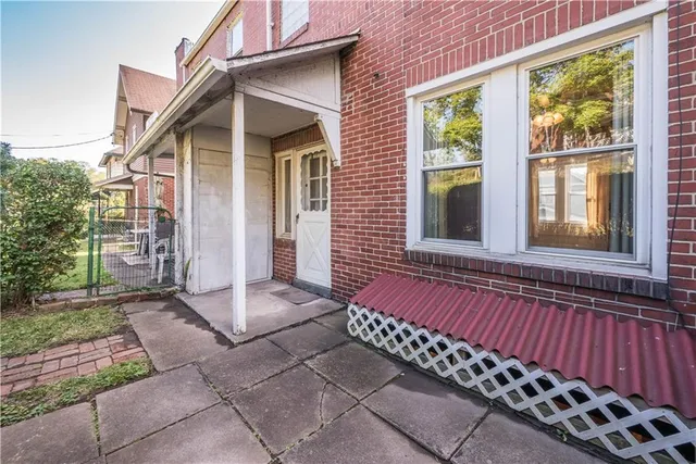 a view of a house with a bench