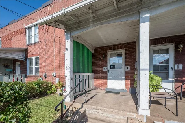 a front view of a building with garden