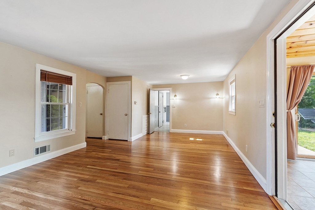 1 Beech Circle Andover, MA 01810 - Photo 12 of 40 a view of an empty room with window and wooden floor