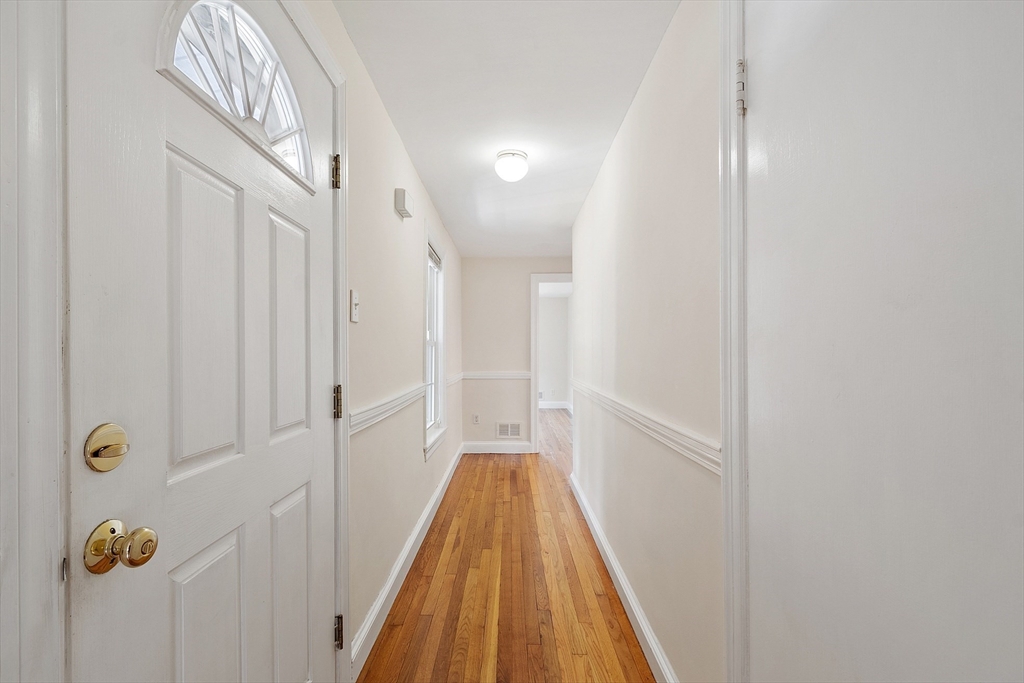 1 Beech Circle Andover, MA 01810 - Photo 16 of 40 a view of a hallway with wooden floor