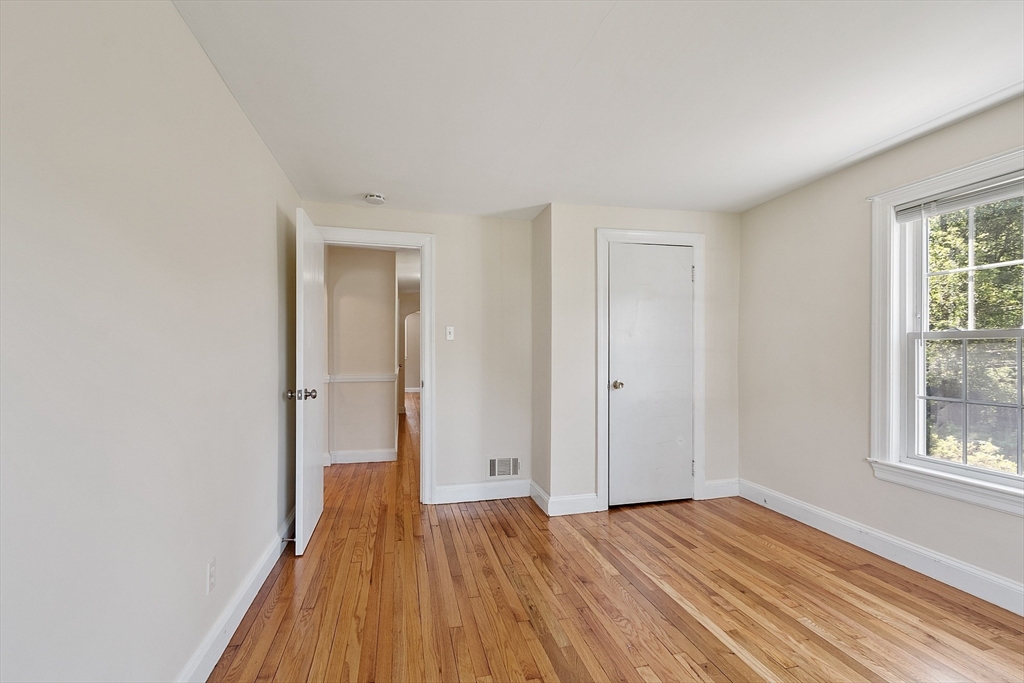 1 Beech Circle Andover, MA 01810 - Photo 20 of 40 a view of a room with wooden floor and window