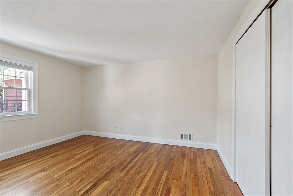 1 Beech Circle Andover, MA 01810 - Photo 22 of 40 a view of a room with wooden floor and white walls