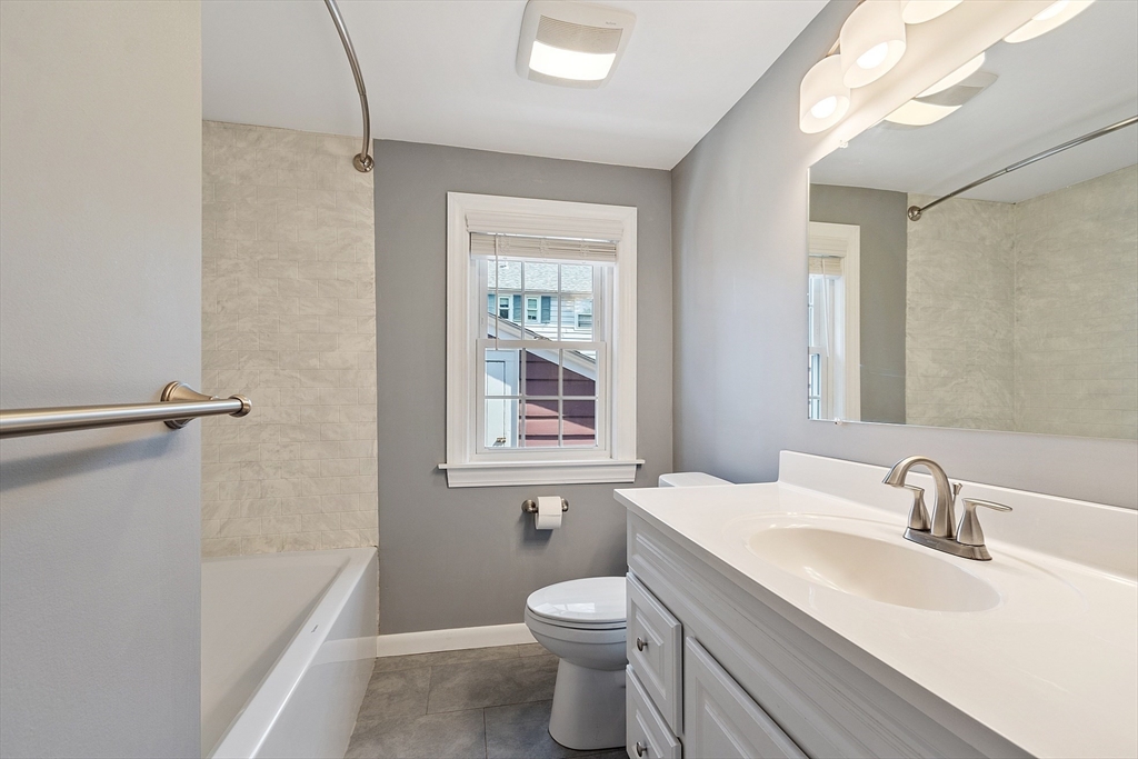 1 Beech Circle Andover, MA 01810 - Photo 23 of 40 a bathroom with a granite countertop toilet a sink and a bathtub