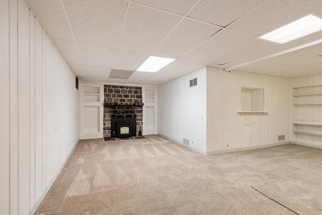 1 Beech Circle Andover, MA 01810 - Photo 26 of 40 an empty room with furniture and fireplace
